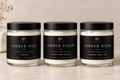 Black Tai whipped body butter trio: Amber Nue, Amber Fleur and Amber Noir in clear glass jars with black lids